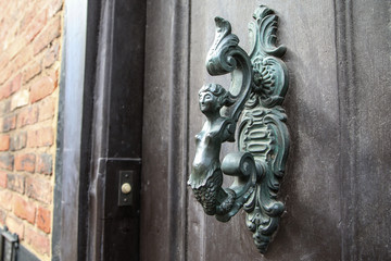 A detail of the old ornamental door handle. Nice example of the artificial detail on onld houses. 