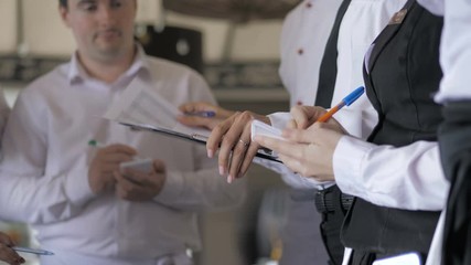 Briefing at the restaurant. Interacting to head manager in commercial kitchen
