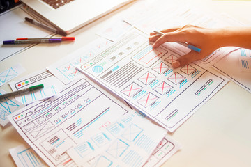 Website designer Creative planning application developer development draft sketch drawing template layout prototype framework wireframe design studio . User experience concept .