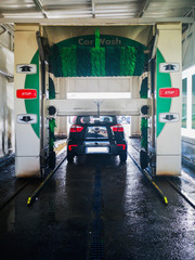 black car washed with rollers