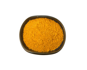 Curry powder in bowl isolated on white background. View from above.