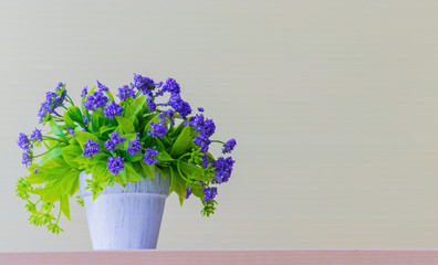  Purple flower vase on the table in the office White background. copy space