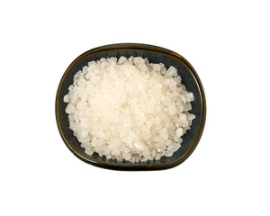 Coarse salt in a bowl isolated on a white background. View from above.