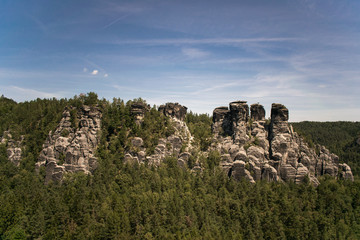 rock formation czech republic europe sunny day summer blue sky green forest
