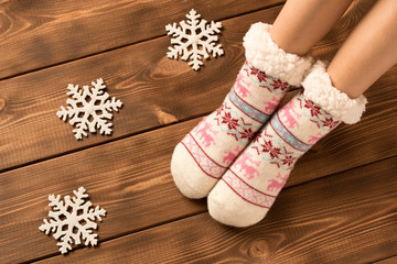 Funny warm socks on the little girl's feet