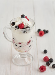 Glass with ice cream and fresh berry