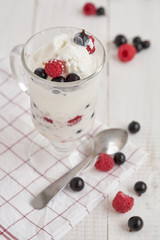Glass with ice cream and fresh berry