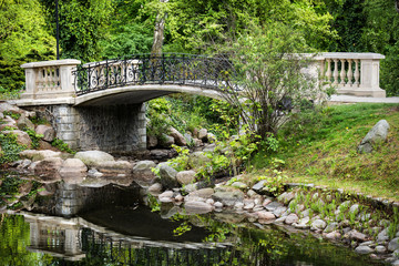 Fototapeta na wymiar Bridge on Canal in Ujazdowski Park in Warsaw