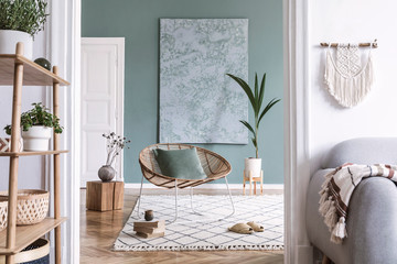 Boho interior design with rattan armchair and bamboo shelf - obrazy, fototapety, plakaty