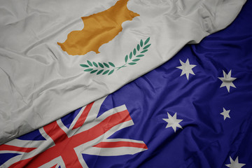 waving colorful flag of australia and national flag of cyprus.