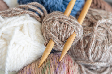 Fototapeta na wymiar Crochet and knitting set. Yarn balls and wood needles. Homemade hobby concept.