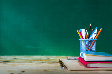 Back to school concept. colored pencil, and supplies  on wooden table © Kanemme6