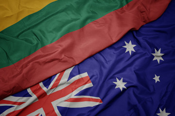 waving colorful flag of australia and national flag of lithuania.