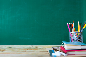 Back to school concept. colored pencil, and supplies  on wooden table