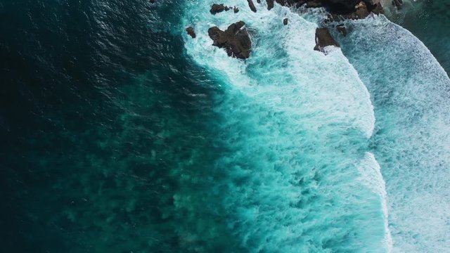 Waves breaking over a reef from above