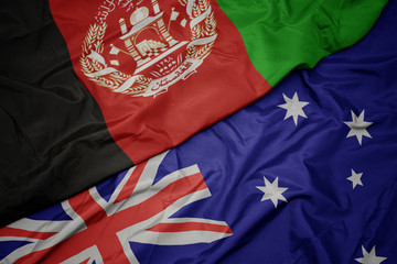 waving colorful flag of australia and national flag of afghanistan.