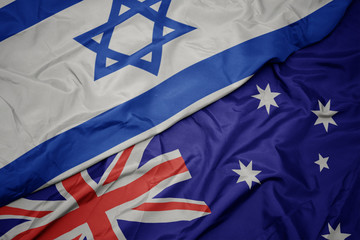 waving colorful flag of australia and national flag of israel.
