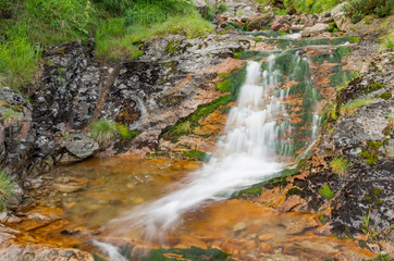 Waterfall in Tatra mountain range in Polish Carpathian Mountains