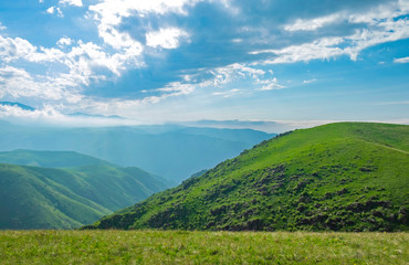 Fototapeta na wymiar Amazing summer landscape, view to the green hills and beautiful sky