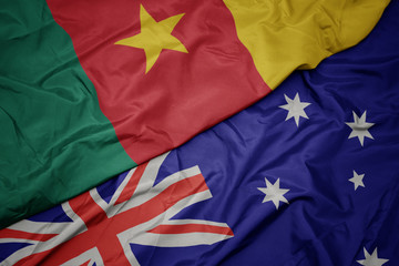 waving colorful flag of australia and national flag of cameroon.