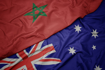 waving colorful flag of australia and national flag of morocco.