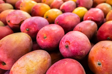 red stacks of mango fruits