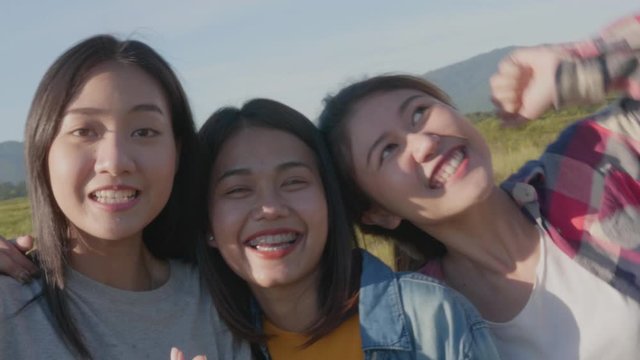 Group of young Asian women doing salfi on the phone, smiling, having fun and happy on summer holiday vacation.