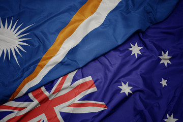 waving colorful flag of australia and national flag of Marshall Islands.