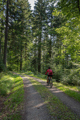 nice and ever young senior woman with her electric mountain bike in the northern Black Forest, Baden-Wuerttemberg, Germany © Uwe