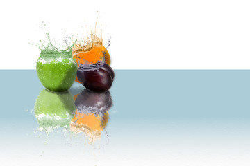 fresh fruit in water splash isolated on white background and reflected on watery surface
