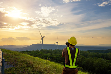 Engineering take a photo sunset and windmill aerial view