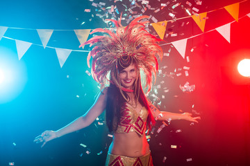 Holidays, party, dance and nightlife concept - Beautiful woman dressed for carnival night