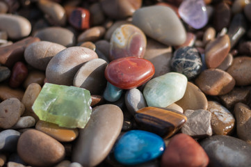 colored minerals on the stone beach in bulk