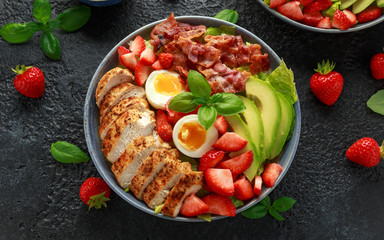 Chicken Cobb salad with strawberries, bacon, avocado and boiled eggs