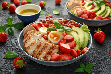 Chicken Cobb salad with strawberries, bacon, avocado and boiled eggs