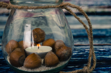 hazelnut and burning candle decoration