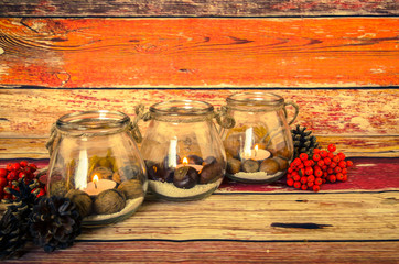 autumnal concept with burning candles