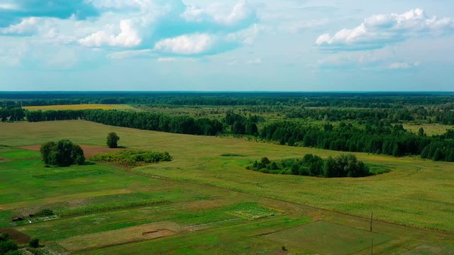 4K Drone. Aerial view of Desna, an urban-type settlement in Kozelets Raion, Chernihiv Oblast in northern Ukraine. Shot on a bright summer day with blue sky and few clouds.