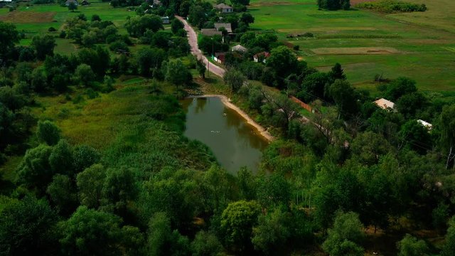 4K Drone. Aerial view of Desna, an urban-type settlement in Kozelets Raion, Chernihiv Oblast in northern Ukraine. Shot on a bright summer day with blue sky and few clouds.