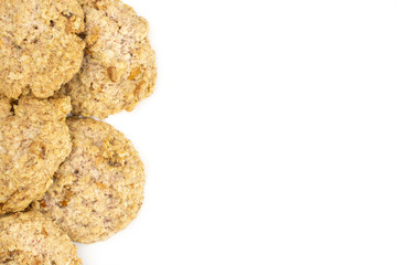 Lot of whole oat crumble biscuit copyspace on right flatlay isolated on white background