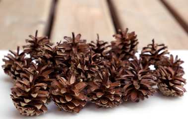 pine cones on wooden background