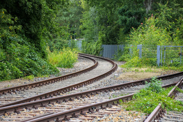 old rails with trees in backgroundv