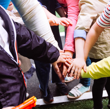 Close up of children keeping hands together