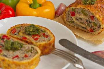 cheese roulade with minced meat, colored paprika and mushrooms. Ketogenic diet.