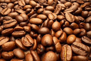 Very big roasted brown coffee beans background