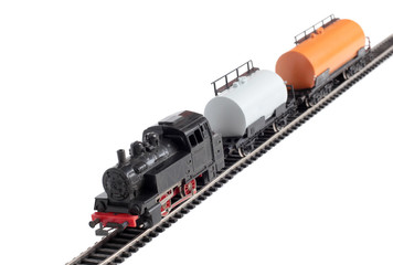 Obraz premium Model of a steam locomotive and cistern on rails on a white background