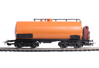 Fototapeta premium Model of a steam locomotive and cistern on rails on a white background
