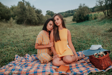 Portrait of two young girls enjoying in the nature
