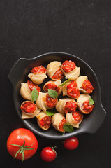 Stuffed large shells pasta with meat and tomatoes in sauce. Conchiglioni. Italian cuisine. Copy space. the view from the top