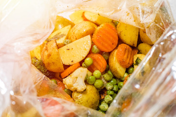Baked vegetables in the oven baking bag. top view
